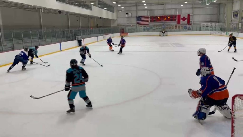 the boys cycling the puck against the hooligans